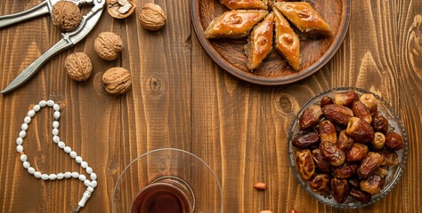 Baklava with nuts on a wooden background. Selective focus.