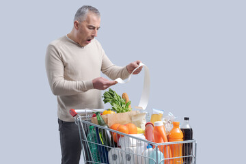 Man checking an expensive grocery bill