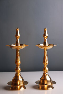 Indian traditional samai or samayee diya brass lamp on gray white background
puja stuff or puja thali with includig kalash agarbatti
diya dhup agarbatti kunku sindoor or Kumkum turmeric haldi or halad