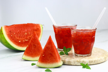 Es Semangka or Watermelon ice drink on isolated white background. Selective focus, copy space for text. 
