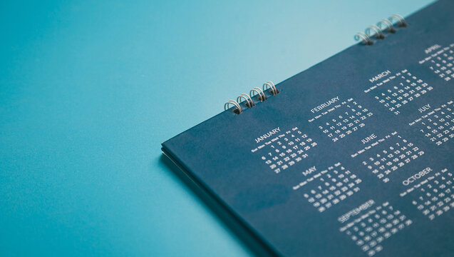 Close top view on white calendar 2022 month schedule Work planning and life concept.