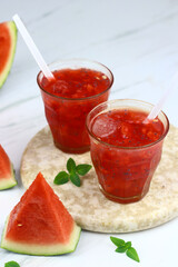 Es Semangka or Watermelon ice drink on isolated white background. Selective focus, copy space for text. 