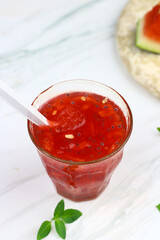 Es Semangka or Watermelon ice drink on isolated white background. Selective focus, copy space for text. 