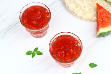 Es Semangka or Watermelon ice drink on isolated white background. Selective focus, copy space for text. 