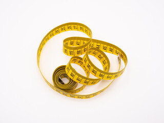 Yellow metric measuring tape on white background