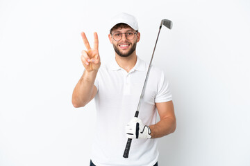 Handsome young man playing golf  isolated on white background smiling and showing victory sign