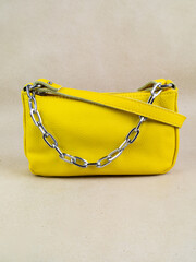 A beautiful women's bag stands on a paper background.