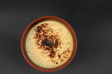 hot cappuccino in a cup. fragrant latte in a paper cup. coffee drinking concept. steam over morning coffee.