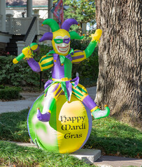 Jester riding a beach ball Mardi Gras lawn decoration in Uptown neighborhood on February 18, 2022...