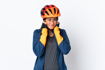 Young cyclist brazilian girl isolated on white  background frustrated and covering ears