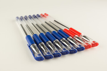 set of blue ballpoint pens lined up hardly