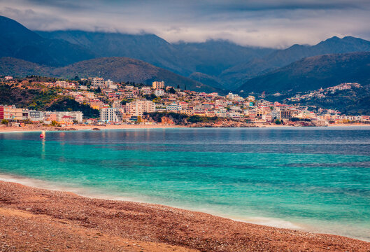 Captivating spring view of Potam Public beach. Amazing morning seascape of Adriatic sea. Magnificent cityscape of Himare town, Albania, Europe. Vacation concept background..
