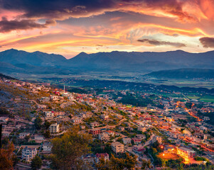 Dramatic morning cityscape of Saranda town. Gorgeous sunrise on Ionian sea. Spectacular outdoor scene of Albania, view from Lekursi Castle. Traveling concept background.