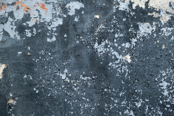 Peeling paint on wall seamless texture. Pattern of rustic black grunge material. Black cracked paint damaged concrete rough texture. Vintage style old rust retro wall texture background.