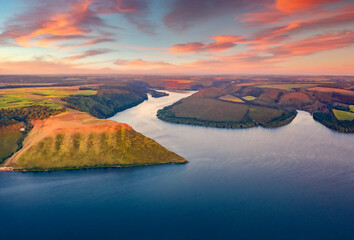Aerial morning view from flying drone of Bakotska Bay. Breathtaking summer sunset on Dnister river, Ukraine, Europe. Beauty of nature concept background.