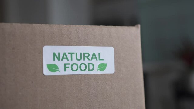 Natural Food Sticker on a Cardboard Box With Organic Products