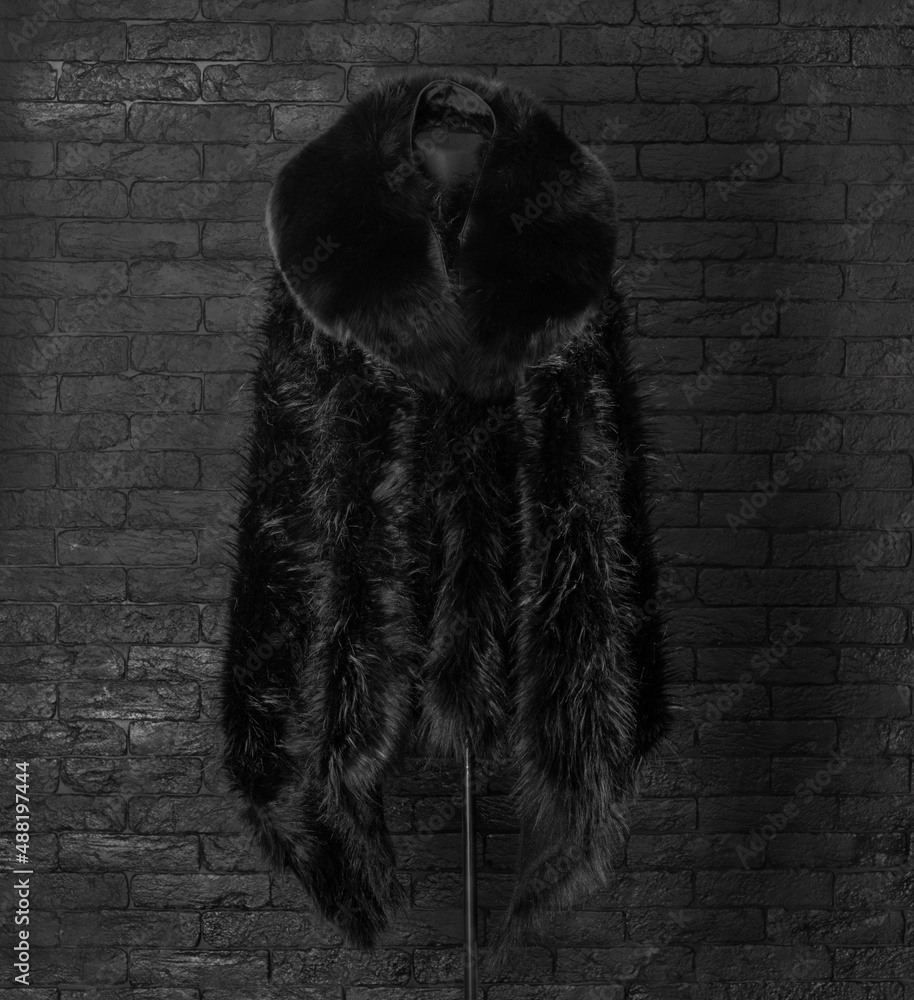 Poster black fur coat on a mannequin