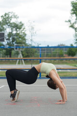 Gymnastic pose on the ground