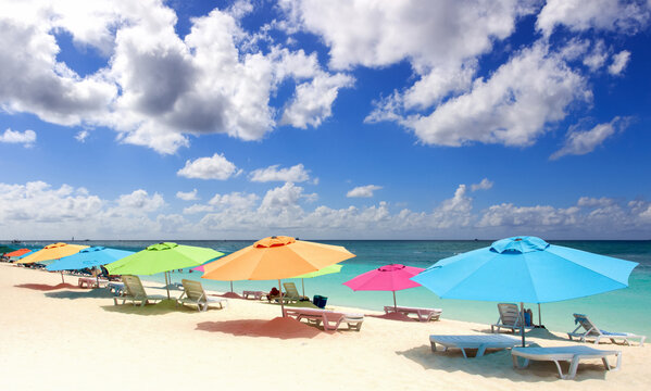 Sandy beach with colorful umbrellas in St Martin, Netherlands