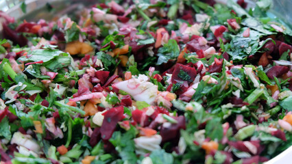 Close up of fresh and raw vegetable chop, with coriander leaves, pak choy, carrot and beetroot.