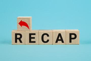 Recap word from wooden blocks. Wooden blocks with the word Recap. A document presenting your skills...