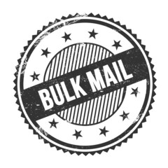 BULK MAIL text written on black grungy round stamp.