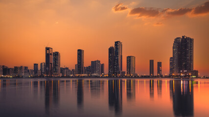 Fototapeta premium sharjah waterfront country skyline at dusk united arab emirates