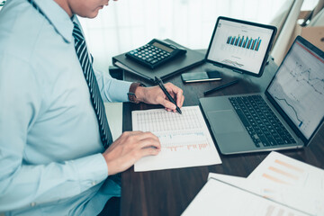 Businessman working on office desk and analyzing new project of accounting finance. Investment, Financial advisor, budget, plan and accounting concept.