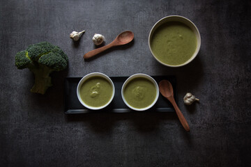 Obraz na płótnie Canvas Healthy food ingredient fresh broccoli soup served on a dark background.