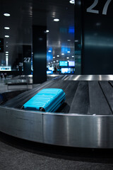 Luggage on the luggage claim conveyor belt at an international airport