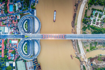 Hai Phong, Vietnam Aug 2020 Aerial view of a bridge from 300m above during late afternoon