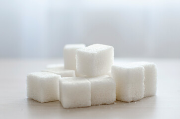 close up of sugar cubes. The concept of unhealthy eating.