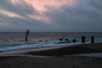 Fototapeta na wymiar Sunrise over the sea at Gorleston-on-sea in Norfolk, UK. January 2022