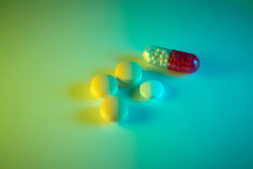 tablets and capsules in two colors neon light 