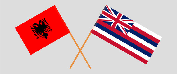 Crossed flags of Albania and The State Of Hawaii. Official colors. Correct proportion