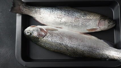 Fresh trout on a table. Healthy seafood and dieting concept.