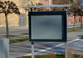 visiting rules, notice board in the town on the square, backlit glass cabinet with glass doors. gray steel with black frame. club information and documents for pedestrians to see