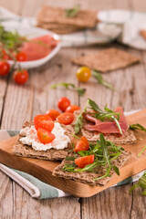 crispy rye bread with sesame seeds, ham and cottage cheese.