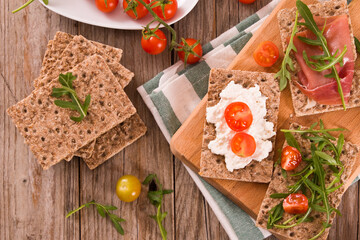 crispy rye bread with sesame seeds, ham and cottage cheese.