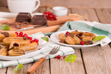 Mini churros with chocolate dipping sauce.