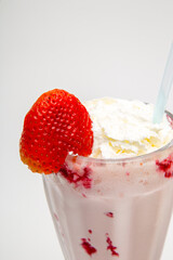 Delicious strawberry milkshake with cream
