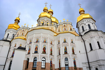 Fototapeta na wymiar Dormition Cathedral in Monastery Complex Pechersk Lavra; Caves Orthodox Monastery with golden cupolas; one of the earliest monasteries of Kievan Rus
