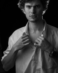 Caucasian man portrait in white shirt in black and white