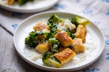 Potato gnocchi with boccoli, rocket and parmesan