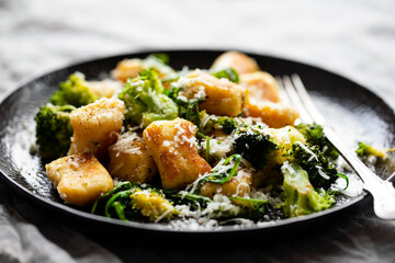 Potato gnocchi with boccoli, rocket and parmesan