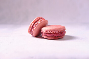 Sweets on a light background, macaron, side view, close-up, space for an inscription