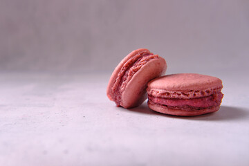 Sweets on a light background, macaron, side view, space for an inscription