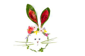 spring nature craft for kids, rabbit or bunny made of leaves and flowers, top view, activity for children