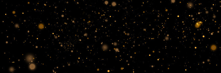 Glowing light effect in yellow gold color with lots of shiny particles isolated on dark background. Vector star cloud with dust.	
