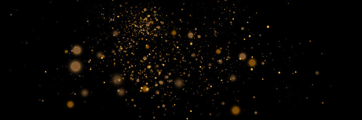 Fototapeta na wymiar Glowing light effect in yellow gold color with lots of shiny particles isolated on dark background. Vector star cloud with dust. 